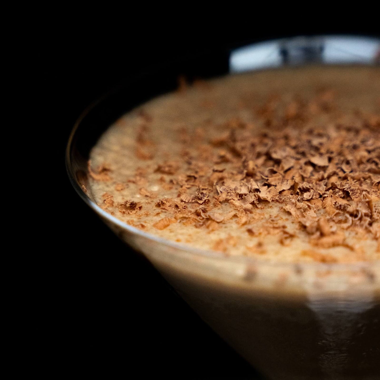 Close up of coffee mocktail with grated chocolate shavings on top