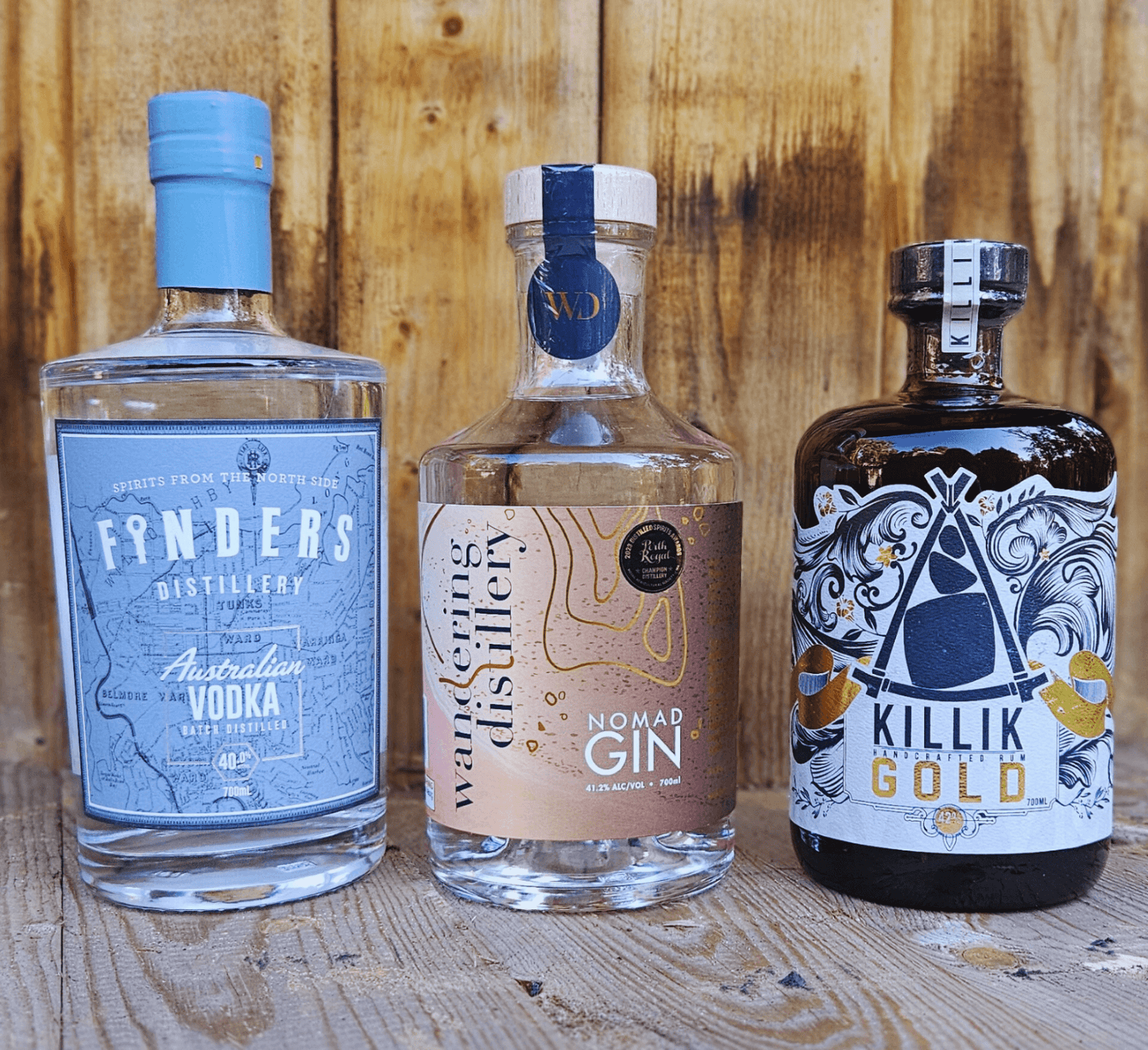 Image shows three bottles of alcohol including Finders Distillery Vodka, Wandering Distillery Gin and Killik Gold Rum