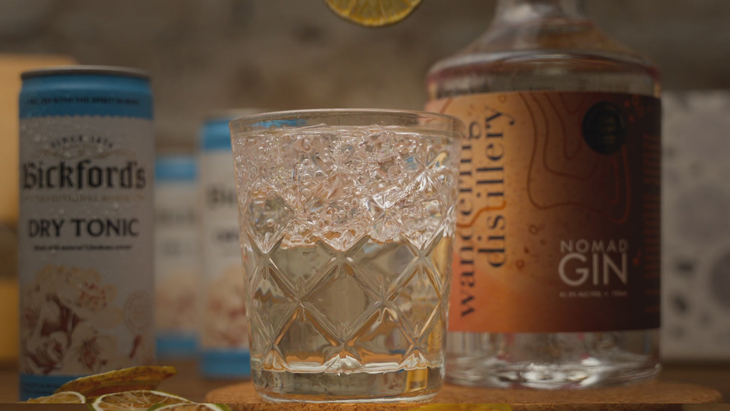 Video is of a gin and tonic cocktail close up, with a dried lime garnish being placed before video zooms out to show cocktail kit contents. Including Wandering Distillery Gin, Bickford's tonic water, and dried lime garnishes. 