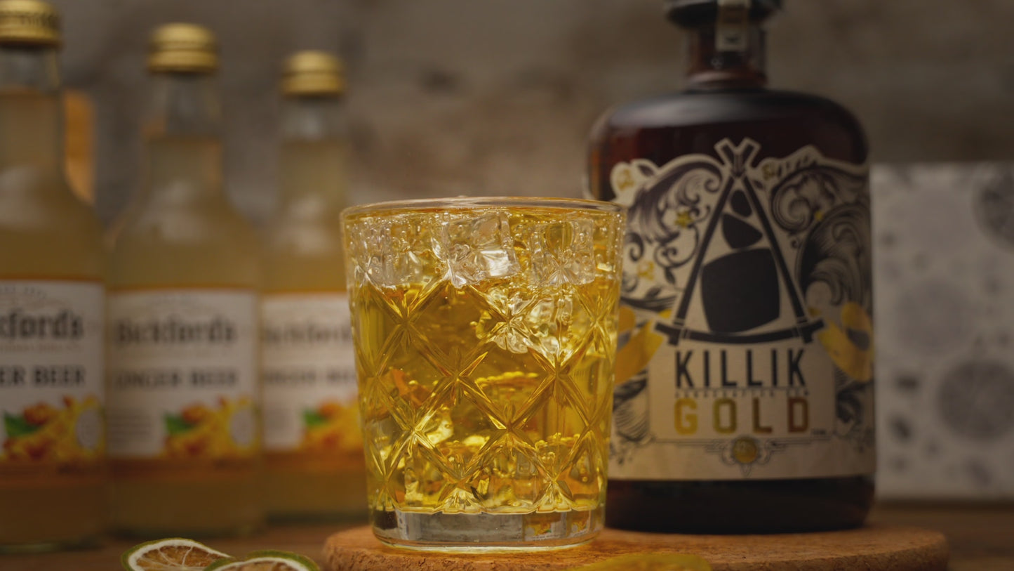 Video shows a hand placing a dried lime garnish into The Forecast cocktail, with its cocktail kit contents around it including a bottle of Killik Gold, Bickford's ginger beer and dried lime slices. Video ends with a quick reverse of the garnish going into the drink